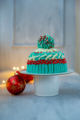 Lovely New Year's Christmas torus in the form of a hat. School sponge cake with tangerines