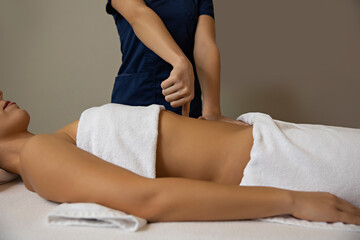Obraz premium Stomach massage in health center