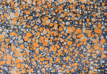 Earth tone colored, Battal Ebru or Somaki art. Traditional Turkish Ebru technique. Painting on water, followed by paper prints. Color paint ebru pattern. Marbling types of Turkish decorative arts.