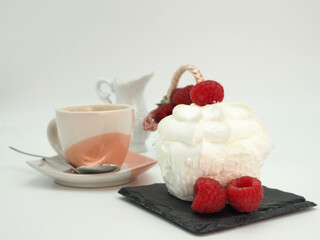 Rustic breakfast. Coffee, milk, merengue, fresh raspberries. Isolated on white background
