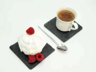 Meringue cake with raspberries, black coffee. View from above