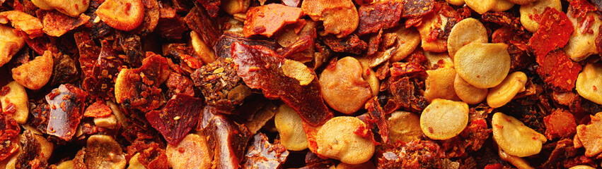 Chili flakes closeup macro shot banner panoramic