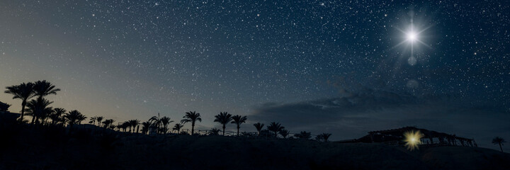 The star shines over the manger of christmas of Jesus Christ. panorama