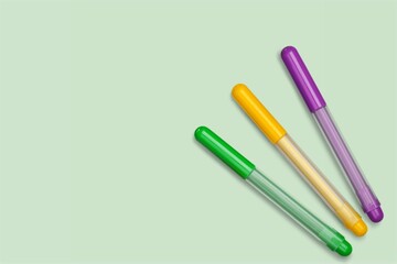 Colored markers on the background is pen with thick writing point for writing or drawing.