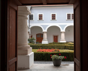 Fototapeta na wymiar Slavonski brod, Croatia - Courtyard of the Franciscan Monastery of the Holy Trinity built in 1727