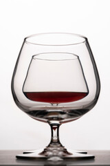 glasses for cognac on a white background. silhouette of glass goblet for alcohol