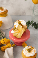 Fototapeta na wymiar Passion fruit vanilla butter cream cupcake
