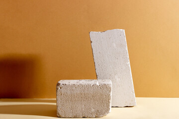Background with geometric shapes made of concrete for cosmetic products. Rectangular podiums with...