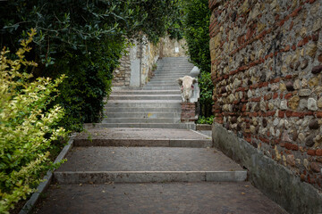 Old town street with stone staircases going up to San Pietro Castle, Verona, Veneto region, Italy