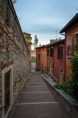 Fototapeta na wymiar Old town street with stone staircases going down to Stone Bridge (Ponte di Pietra), Verona, Veneto region, Italy