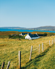 Isolated croft farm house by the bay