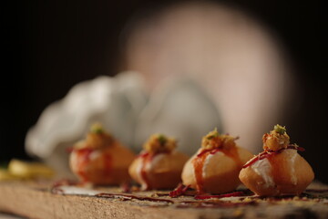 Spicy Pani Puri Golgappe with bowl, Chat item, North Indian street food, Indian panipuri snack, potato stuffing spicy Indian Street Food © AVdeziner