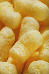 Yellow dessert Corn sticks in powdered sugar texture.
