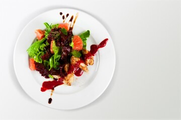 Tasty fresh steak with baked vegetables on white plate. Meat steak medium rare roasted