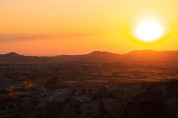 Sunset over the mountains. Sunset scene with silhouettes of mountains