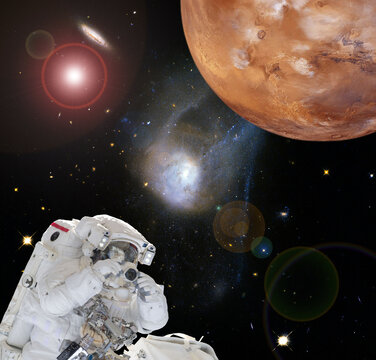 Astronaut and Mars. Deeps space. The elements of this image furnished by NASA.