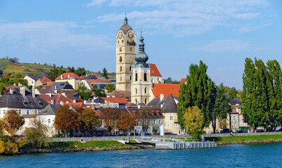 Shipping pier at Krems on the river Danube with the towers of the parish church Saint Nicholas and...