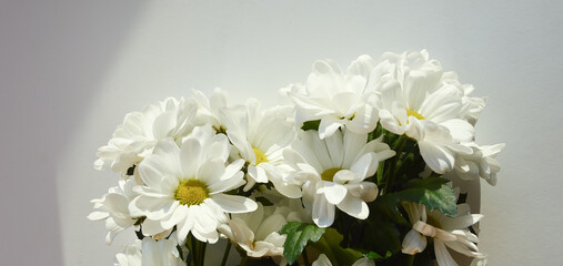 a bouquet of white flowers. fluffy chrysanthemums, daisies. a gentle background for the holidays.