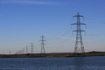 Electricity pylon (Strommasten) also overhead line pylon. carring electric energy though lines via pylon across countryside