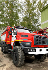 Ural next fire truck for the work of the Ministry of Emergency Situations. Russian car for extinguishing fires and fire. Professional transport of firefighters.