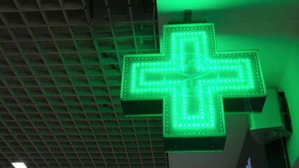 Green Pharmaceutical Cross. Pharmacy Street Sign.
