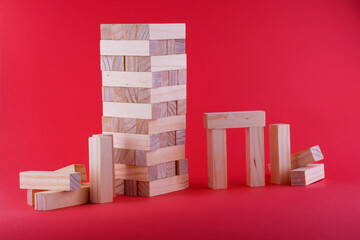 Wooden brick bars on a red background from the board game