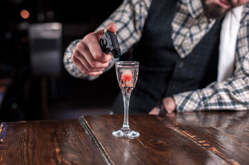 Bartender makes a cocktail at the brasserie
