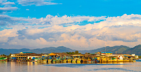 Industrial port Ranong and old fisher boats landscape panorama Thailand.