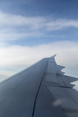 beautiful view of the plane wing and blue clouds