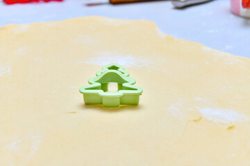 Green herringbone shape for baking cookies from rolled dough.