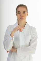 Covid19, coronavirus, healthcare and doctors concept. Portrait of optimistic russian female doctor assure everything be okay, wear medical mask to prevent catching virus, white coat.