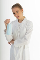 Covid19, coronavirus, healthcare and doctors concept. Portrait of optimistic russian female doctor assure everything be okay, wear medical mask to prevent catching virus, white coat.