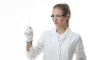 The girl laboratory assistant shows an indicator tube with the result of the analysis. Laboratory assistant in a medical laboratory or a petroleum product quality laboratory