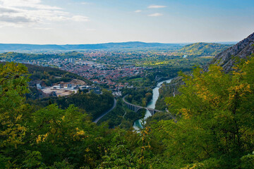 The western Slovenian city of Nova Gorica viewed from the slopes of Mount Skabrije. The Soca River is on the right with the historic Solkan Bridge in the foreground
