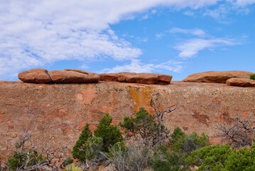 Close up of flat stones lying on red rock. Needles District in Canyonlands National Park, Utah.