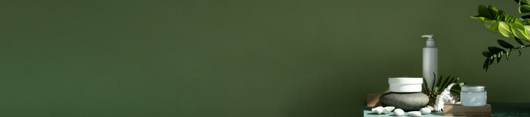 Basil color green background. White tube with mock up for you cosmetics and care products Front view High quality photo. Eco cosmetic set on stone podium.