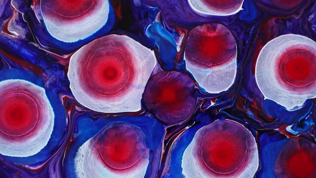 Background made with alcohol ink. Blooming magical red flowers. Ink in liquid. Circles of paint radiating over the surface. Deep ink spaces.