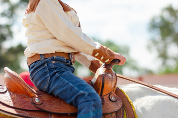 Close up of a girl ridding a horse
