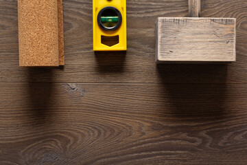 Wood laminate floor and tools background texture. Wooden laminate