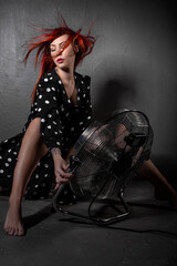 Redhead Girl in polka-dot dress and cowboy boots 