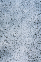 sea foam with abstract texture of air bubbles as natural background