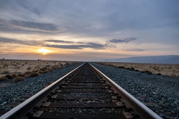 railroad tracks in the sunset