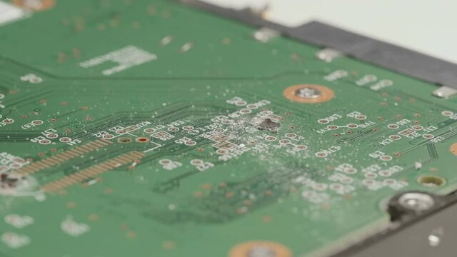 Banging a hammer on a hard drive. 
Close-up footage of a hammer hitting a hard drive.