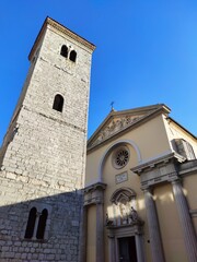 Fototapeta premium Church of the Assumption of Blessed Virgin Mary and sloping tower in Rijeka - Croatia.