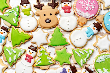 Christmas sugar cookies with icing decorations. Top view holidays background