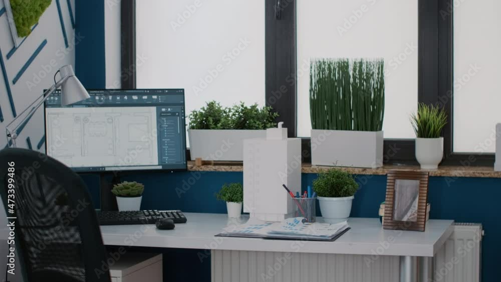 Poster close up of monitor with digital blueprints plans on desk for architecture design of building layout