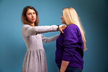 A young woman practices the technique of kinesiology. Chiropractic treatment, Back pain relief. Physiotherapy for female patient, Kinesiology.