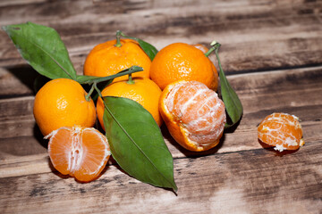 Mandarin.  mandarins lie on a wooden table.