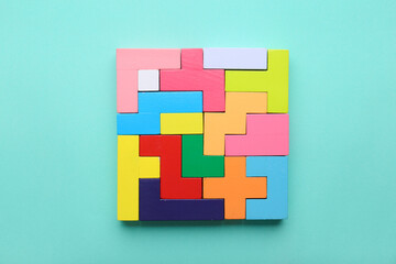 Multicolored puzzle, cubes on the light background