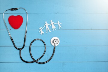 family health care and insurance concept with stethoscope